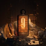 Afnan 9PM Elixir 100ml bottle on rocks with warm sparks