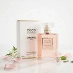 Chanel Coco Mademoiselle Eau De Parfum 100ml bottle and box with rose petals