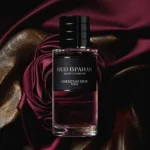 Dior Oud Ispahan Eau De Parfum 100ml bottle on deep red silk