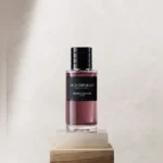 Dior Oud Ispahan Eau De Parfum 100ml bottle on a stone pedestal
