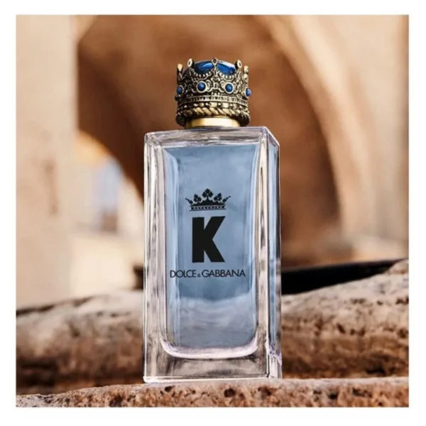 Dolce & Gabbana K By Dolce & Gabbana Eau De Toilette 100ml bottle on a sunlit stone ledge