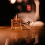 Lattafa Khamrah Eau De Parfum 100ml bottle on a dark bar counter