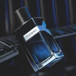 Yves Saint Laurent Y Eau De Parfum 100ml bottle on dark leather